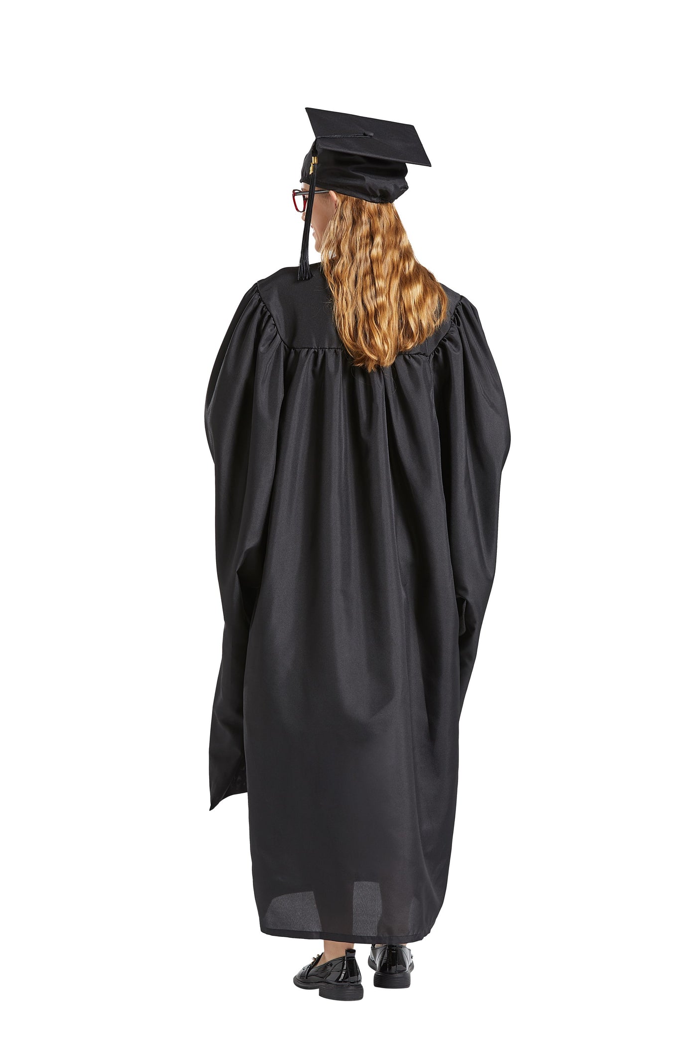 A woman in a graduation gown holding up a black graduation hat photo – Free  Person Image on Unsplash